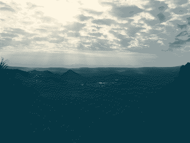 A grayscale dithered photograph of a desert vista