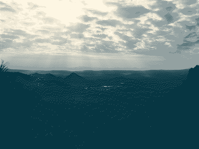 A 4-color dithered photograph of a desert vista