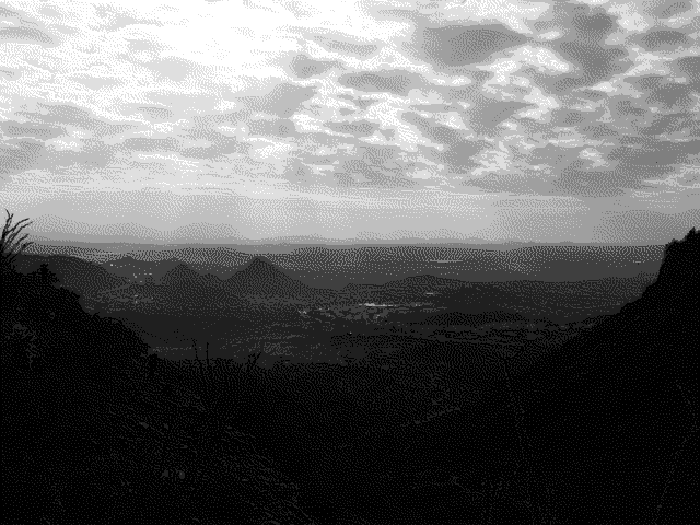 An 8-shade grayscale dithered photograph of a desert vista
